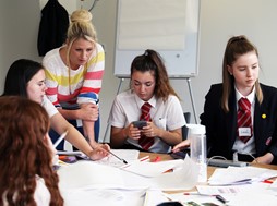 Photo 2 - The team from Maidenhill school in Gloucestershire work on their costs with Barbara Silcock-  Performance Analyst for Amey.JPG